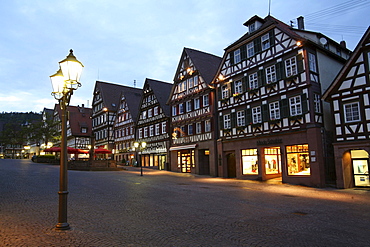 view of market square with half-timbered houses and old historic birthplace of writer and painter Hermann Hesse 1877-1962 cityscape night view Black Forest Baden-Wurttemberg Germany