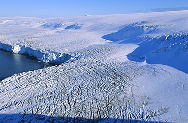 View of a land-based glacier calving into the sea.  Hannah Point, Livingston Island, ntarctic Peninsula, Antarctica.