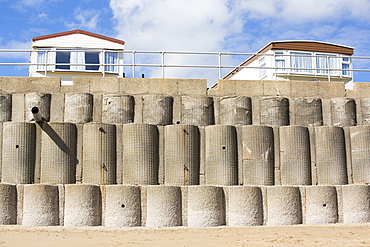 Concrete sea defences at Beach Bank Caravan Park in Ulrome near Skipsea on Yorkshires East Coast, UK. The coast is composed of soft boulder clays, very vulnerable to coastal erosion. This section of coast has been eroding since Roman times, with many villages having disappeared into the sea, and is the fastest eroding coast in Europe. Climate change is speeding up the erosion, with sea level rise, increased stormy weather and increased heavy rainfall events, all playing their part.