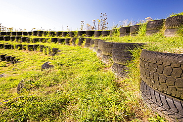 An ampitheatre built with used tyres at Mount Pleasant Ecological Park, Porthtowan, Cornwall, UK.