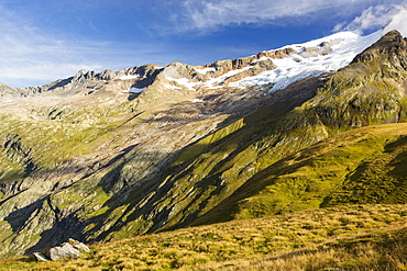 The rapidly retreating Glacier des glaciers on the Aig des Glaciers, part of the Mont Blanc range. The lateral moraines are clearly visible that once bordered the ice, as is the fresh rock exposed by the rapid retreat.