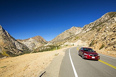 A car travelling from Lee Vining into Yosemite National Park, California, USA.