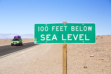 A sign at 100 feet below sea level in Death Valley which is the lowest, hottest, driest place in the USA, with an average annual rainfall of around 2 inches, some years it does not receive any rain at all.