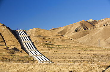 A pumping station sends water uphill over the mountains on the California aquaduct that brings water from snowmelt in the Sierra Nevada mountains to farmland in the Central Valley. Following a four year long catastrophic drought, irrigation water is in short supply, with $2 billion annually wiped off the agricultre sector.