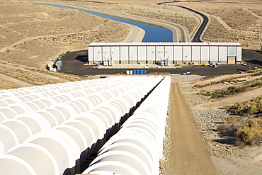 A pumping station sends water uphill over the mountains on the California aquaduct that brings water from snowmelt in the Sierra Nevada mountains to farmland in the Central Valley. Following a four year long catastrophic drought, irrigation water is in short supply, with $2 billion annually wiped off the agricultre sector.