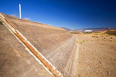 Lake Isabella near Bakersfield, East of California's Central valley is at less than 13% capacity following the four year long devastating drought. The reservoir has dropped so low, that the water level is below the outflow pipe, shown here.