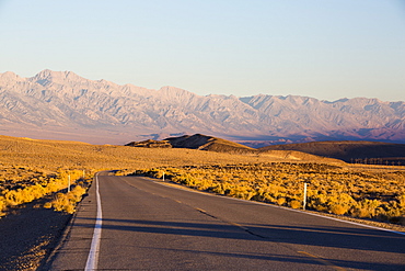 Dawn light on the eastern slopes of the Great Western Divide mountains from the road into Death Valley, California, USA.