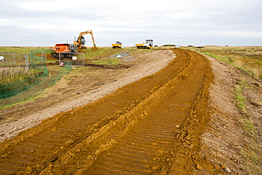 Repairing damage caused to the coastal sea defences in Blakeney, Norfolk by the December 2013 storm surge.