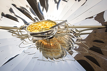 A solar cooker being used to cook food at the offices of WWF India, in Delhi, India.