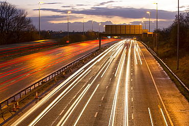 Rush hour traffic on the M6 Motorway near Preston, Lancashire, UK at dusk.