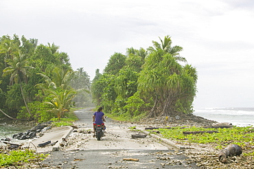 Tuvaluans watch as the high tide inundates their island home due to global warming induced sea level rise, Funafuti, Tuvalu, Pacific