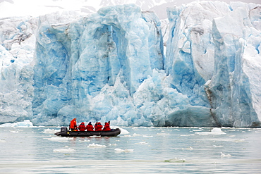 Passengers on Zodiaks off the Russian research vessel, AkademiK Sergey Vavilov an ice strengthened ship on an expedition cruise to Northern Svalbard in front of a glacier.