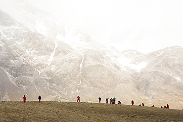 Passengers on an expedition cruise to Anarctica recreat part of Shakleton's famous walk across South Georgia. The group are walking from Fortuna Bay to Stromness.