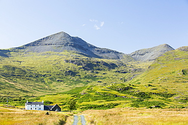 An isolated house beneath Ben More on the Isle of Mull, Scotland, UK.