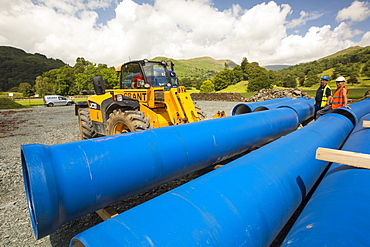 A lorry delivering hydro pipes for the New Rydal Hall Hydro electric scheme, Ambleside, Lake District, UK.