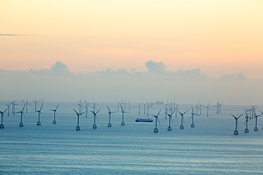 An offshore wind farm and gas platfroms in morecame bay from the summit of Black Combe, Cumbria, UK.