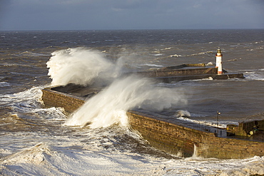 Storm waves from an extreme low pressure system batter Whitehaven harbour, Cumbria, UK, on the 10th December 2014.