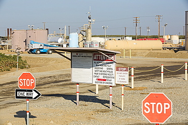 A fracking truck on a site being fracked near Wasco in California's Central Valley, USA. Fracking for natural gas and oil, has reduced energy prices in the US, but fracking is a water hungry industry, that competes directly with the agricultural sector for water. After a 4 year long drought water is running out.  Fracking also contaminates ground water supplies from all the chemicals that are pumped underground to frack the fossil fuel bearing rocks.