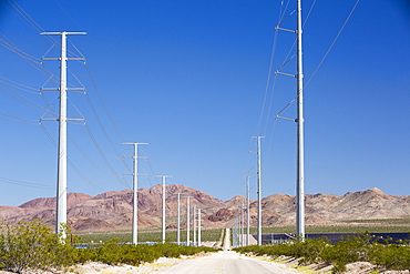 Pylons take renewable electricity from the Copper Mountain Solar power plant in Nevada, USA.