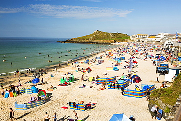 Holiday makers on the beach in St Ives, Cornwall, UK.