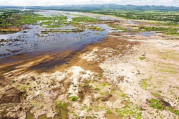 In mid January 2015, a three day period of excessive rain brought unprecedented floods to the small poor African country of Malawi. It displaced nearly quarter of a million people, devastated 64,000 hectares of land, and killed several hundred people. This shot shows the scale of the flood destruction, with ruined farmland, from the air.