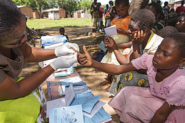 January 2015 saw a three day period of excessive rain which brought unprecedented floods to the small poor African country of Malawi. It displaced nearly quarter of a million people, devastated 64,000 hectares of land, and killed several hundred people. This shot shows A Medicin Sans Frontieres clinic in Makhanga testing local people, many of whom now have malaria, as a result of the drying up flood waters providing ideal breeding grounds for mosquitoes.