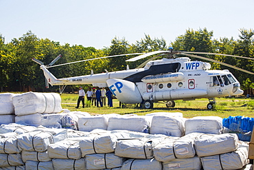 In mid January 2015, a three day period of excessive rain brought unprecedented floods to the small poor African country of Malawi. It displaced nearly quarter of a million people, devastated 64,000 hectares of land, and killed several hundred people. This shot shows A Russian Mi8 helicopter being used by the United Nations, World Food Program to deliver food aid to areas still cut off by the flooding around Makhanga and Bangula.