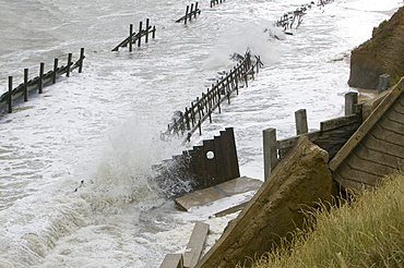 The lifeboat launching ramp destroyed as waves crashing against the coast at Happisburgh on the fastest eroding section of the UK coast, Norfolk, England, United Kingdom, Europe