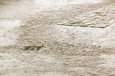 Torrential rain quickly leads to drains being overwhelmed in Manchester, England, United Kingdom, Europe