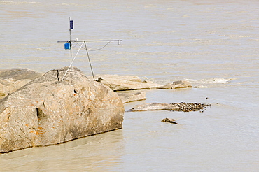 Scientific equipment measuring the meltwater from the Russell Glacier that drains the Greenland Ice Sheet 26 km inland from Kangerlussuaq, Greenland, Polar Regions