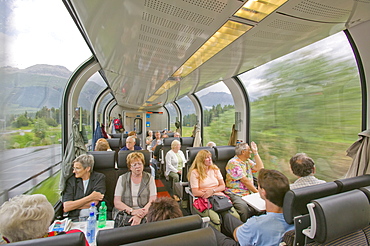 Passengers on the Bernina Glacier express that goes from Chur in Switzerland to Tirano in Italy, Europe