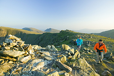 A man and women fell running on Great Carrs in the Lake District National Park, Cumbria, England, United Kingdom, Europe