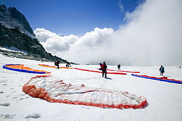 Paraponters preparing to take off from the Grand Montets above Chamonix, Haute Savoie, France, Europe