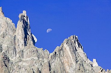 Moon rising over the Aiguille Du Grepon near Chamonix, Haute Savoie, France, Europe