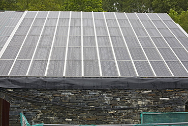 Solar panels on a building at the Centre for Alternative Technology in Machylleth, Wales, United Kingdom, Europe