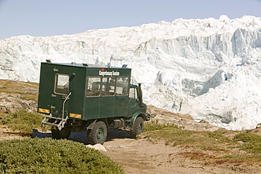 An off road vehicle taking tourists to the Russell Glacier near Kangerlussuaq in Greenland, Polar Regions