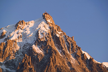 The Aiguille du Midi at sunset above Chamonix, Haute Savoie, France, Europe