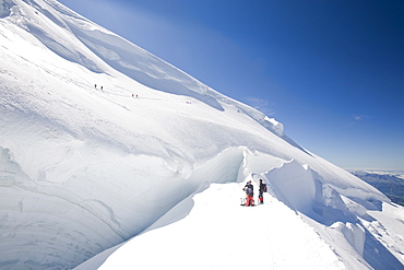 Climbers on the 4000 metre peak of Mont Blanc Du Tacul above Chamonix, Haute Savoie, France, Europe