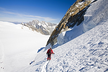 Climber on the 4000 metre peak of Mont Blanc Du Tacul above Chamonix, Haute Savoie, France, Europe