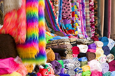 A market stall in Leicester selling colourful fabrics, Leicestershire, England, United Kingdom, Europe