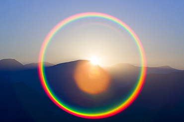 Sunset over the Lake District fells with a circular rainbow, Cumbria, England, United Kingdom, Europe