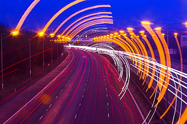 Car lights on the M1 motorway in Leicestershire, England, United Kingdom, Europe