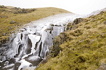 Gale force winds in 2008 blew water from a waterfall in Stake Pass back up the hill coating the surrounding area in thick ice, Lake District, Cumbria, England, United Kingdom, Europe