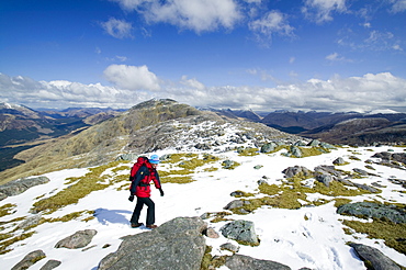 A woman near the summit of the Munro Beinn Sgulaird above Glen Creran between Oban and Glen Coe, Scotland, United Kingdom, Europe