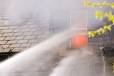 A fire being tackled by firemen in Ambleside, Lake Distruct, Cumbria, England, United Kingdom, Europe