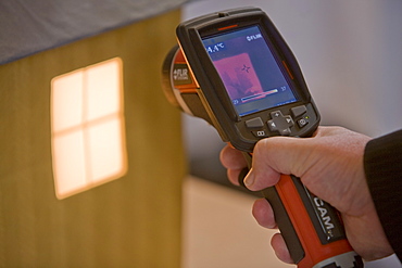 A thermal imaging camera being used to demonstrate heat loss on display at the Future Homes conference at the Crichton Carbon Centre in Dumfries, Scotland, United Kingdom, Europe