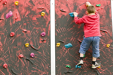 Child on a climbing wall