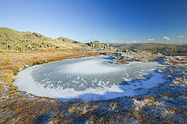 A frozen tarn on Glaramara in the Lake District, Cumbria, England, United Kingdom, Europe