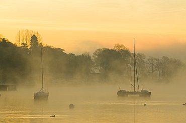 A misty morning on Lake Windermere in the Lake District, Cumbria, England, United Kingdom, Europe