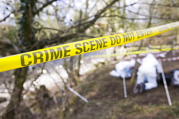 Police Scenes of Crime Officers investigate a murder scene on the banks of the river Kent near Kendal, Lake District, Cumbria, England, United Kingdom, Europe